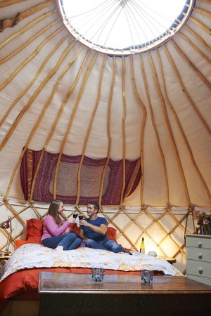 Couple Enjoying Luxury Camping Holiday In Yurtのeditorial素材