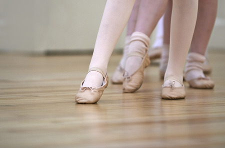 Close Up Of Feet In Children's Ballet Dancing Class