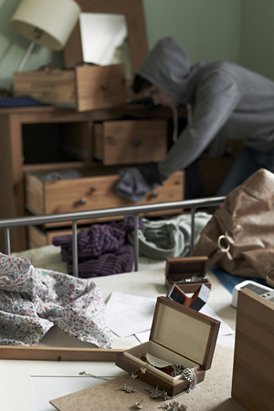 Burglar Stealing Items From Bedroom During Hose Break Inの写真素材