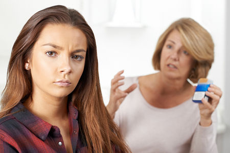 Mother Talking To Teenage Daughter About Dangers Of Smokingの写真素材