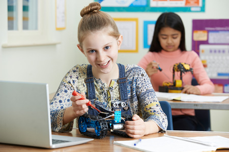 Portrait Of Female Pupil In Science Lesson Studying Roboticsの写真素材