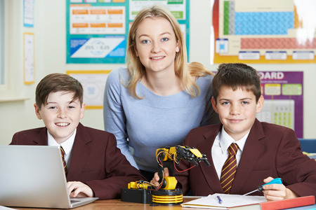 Portrait Of Teacher With Pupils In Science Lesson Studying Roboticsの写真素材