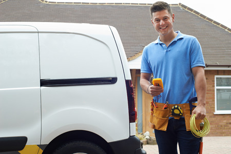 Portrait Of Electrician With Van Outside Houseの写真素材