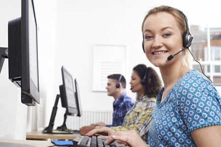 Portrait Of Female Customer Services Agent In Call Centreの写真素材