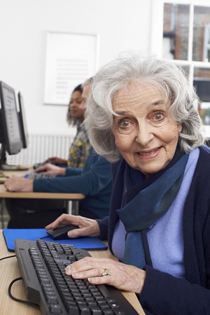 Portrait Of Senior Woman Attending Computer Classの写真素材