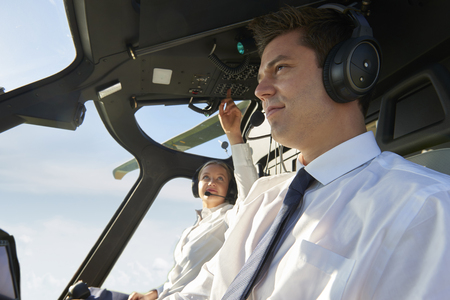 Pilot And Co Pilot In Cockpit Of Helicopterの写真素材