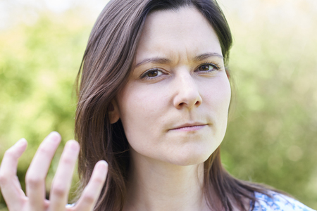 Outdoor Portrait Of Frustrated Young Womanの写真素材