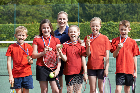 Portrait Of Winning School Tennis Team With Medalsの写真素材