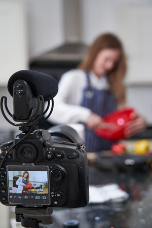 Female Vlogger Making Social Media Video About Cooking For The Internetの写真素材