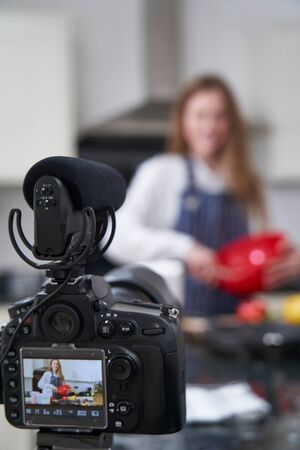 Female Vlogger Making Social Media Video About Cooking For The Internetの写真素材