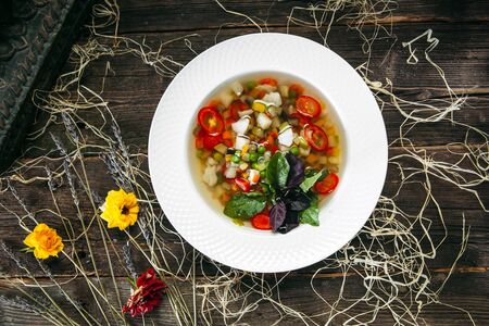 Healthy natural organic vegetable vegan soup on the wooden table, horizontalの写真素材