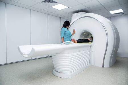White medical device for magnetic resonance tomography in a hospital, horizontalの写真素材