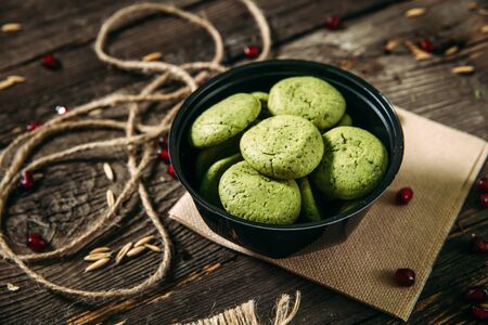 Healthy sweet mint cookies dessert in a bowl on the wooden table, horizontal formatの写真素材