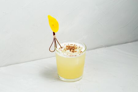 Sweet delicious sour muddy decorated cocktail on the white background, horizontalの写真素材