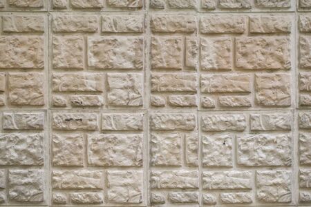 Texture background beige decorative stone tile with a pattern, horizontal