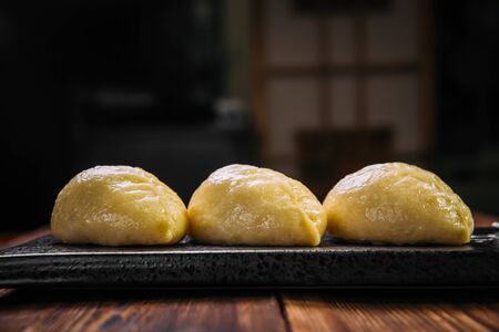 Side view on Korean steamed pjan-se pigodi pies with cabbage and meat , horizontalの写真素材