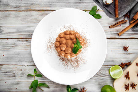 Top view on gourmet sponge cake with chocolate sprinkles and mint, horizontalの写真素材