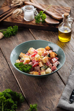Malibu salad dressed with mayonnaise on the wooden tableの写真素材