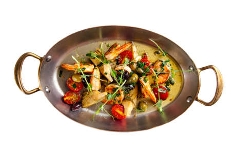 isolated grilled prawns shrimps with vegetables in a metal bowl