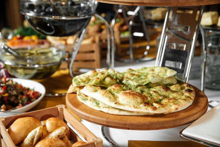 Restaurant lunch catering buffet with focaccia on the board