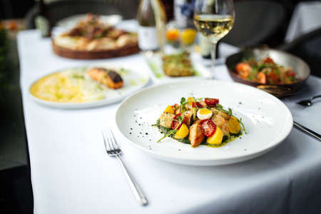 Closeup on white table served with delicious italian foodの写真素材