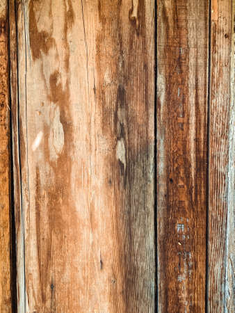 Closeup on old damaged wooden boards wall texture background