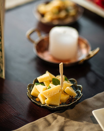 Cheese appetizer platter on the wooden table