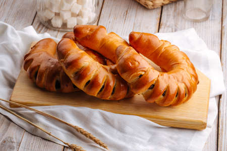 Side view on three fresh baked bagel bunsの写真素材