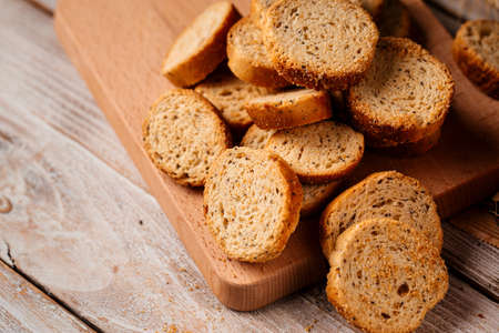 Dried bread crackers on the wooden backgroundの写真素材