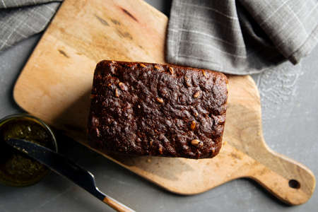 Loaf of rye whole grain bread with pesto sauceの写真素材