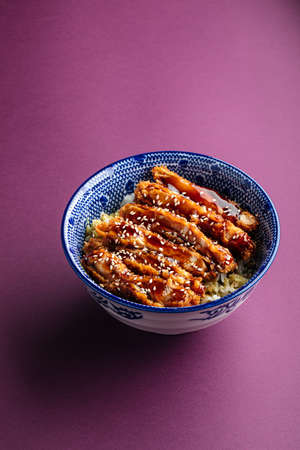 Katsudon fried chicken with rice in a bowlの写真素材