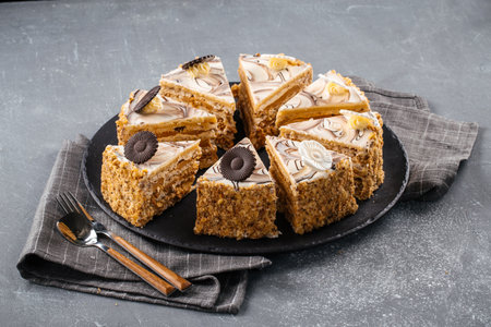 Sliced nut cake on the grey background