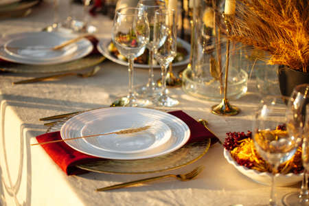 Outdoors nature banquet table set with candlesの写真素材