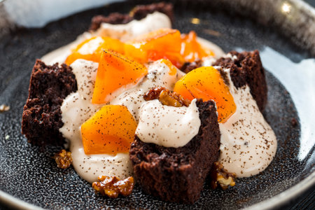 Closeup on persimmon dessert with cream biscuitの写真素材