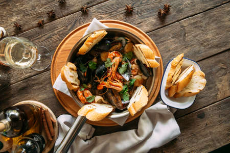 Assorted seafood basket bowl with toasted breadの写真素材