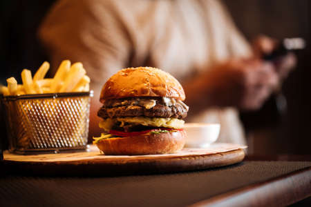Burger set with fries with a blurry backgroundの写真素材