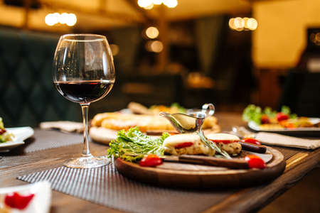 Evening wine celebration dinner table on blurryの写真素材