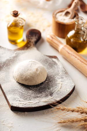 Preparation of dough for kneading pizza cookingの写真素材