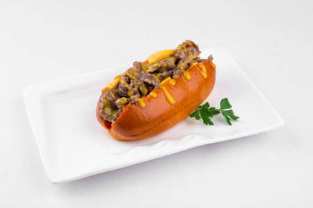 Isolated beef hot dog with mustard on the whiteの写真素材