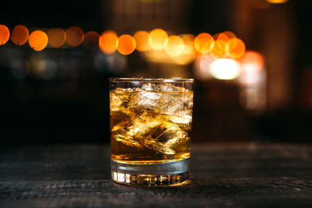 Whiskey old fashioned cocktail on the bar deskの写真素材