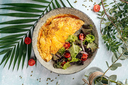 Rustic omelette with vegetables saladの写真素材