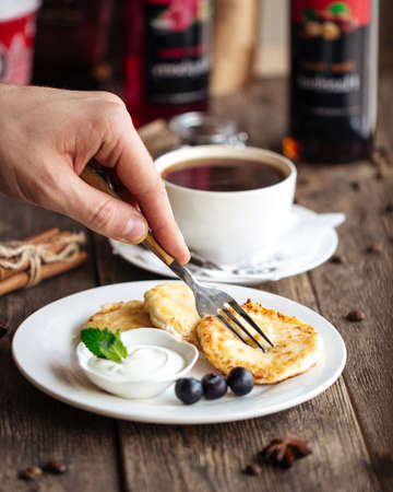 Russian cottage cheese pancakes with sour cream