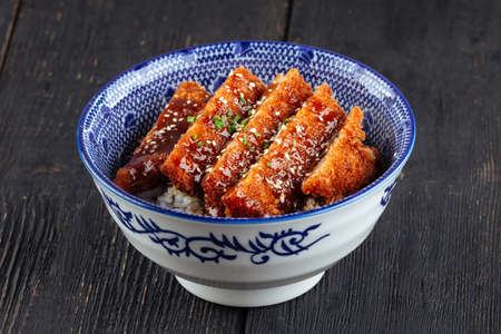 Bowl of japanese katsudon fried chicken with riceの写真素材