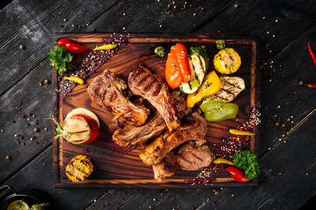 Grilled lamb ribs entrecote with vegetablesの写真素材