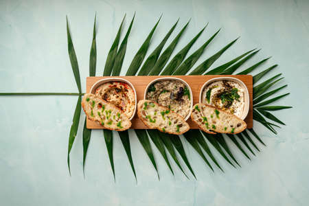 Mazeh appetizers set with hummus and other dips