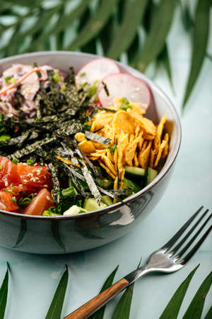Hawaiian salmon poke bowl with rice and vegetables
