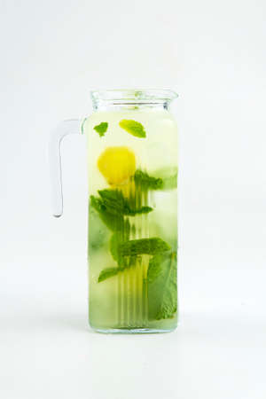 Isolated glass jug of green lemonade