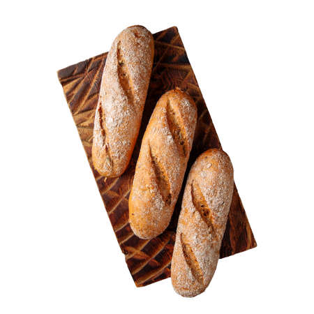 Isolated three loafs of white bread on a board