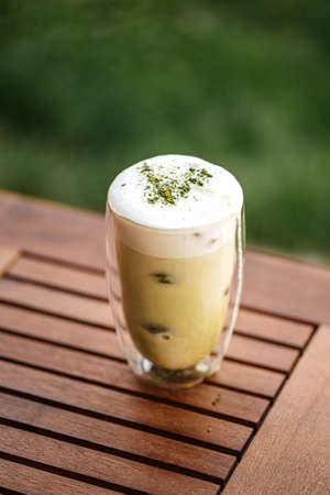 Matcha green tea with ice cubesの写真素材