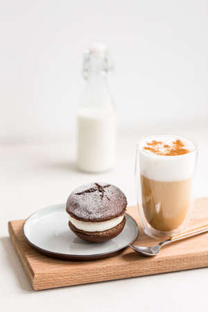 Coffee latte with whoopie pie cream dessertの写真素材